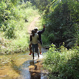  &ndash; This is the same stream the goat was dragged through during my visit, now this poor young man is dragging James (who doesn't want to get his feet wet)......Dec. 2, 2007…. © 2007 NHA Photos
