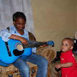  &ndash; Lucy playing guitar…. © 2007 NHA Photos