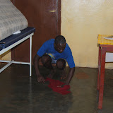  &ndash; Disinfecting and water removal continues several days after the flood at Kroo Bay Clinic. …. © 2008 September NHA Media Photos, Salu Bangura, photographer.
