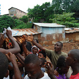  &ndash; He distributes the items, but they quickly run out.…. © 2008 September NHA Media Photos, Salu Bangura, photographer.