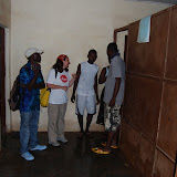  &ndash; James and Vicki meet with the workers who are clearing &amp; disinfecting the clinic. …. © 2008 September NHA Media Photos, Salu Bangura, photographer.