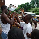  &ndash; I enlist the help of a community council leader to help distribute what we have left…. © 2008 September NHA Media Photos, Salu Bangura, photographer.