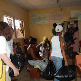  &ndash; Bringing supplies into Kroo Bay Clinic to present to medical staff. . …. © 2008 September NHA Media Photos, James B. Mansaray, photographer.