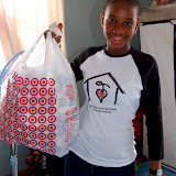  &ndash; Lucy Mansaray holding our single bag of syringes &amp; needles for Kroo Bay....© 2008 September NHA Media Photos, James B. Mansaray photographer.