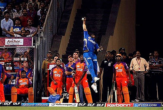 [Mumbai Indians' Kieron Pollard jumps to catch the ball near the boundary line[4].jpg]