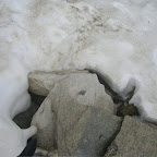 It was July and we had to walk through this snow. Was creepy as hell, we didn't know if there were stones or holes under the snow...