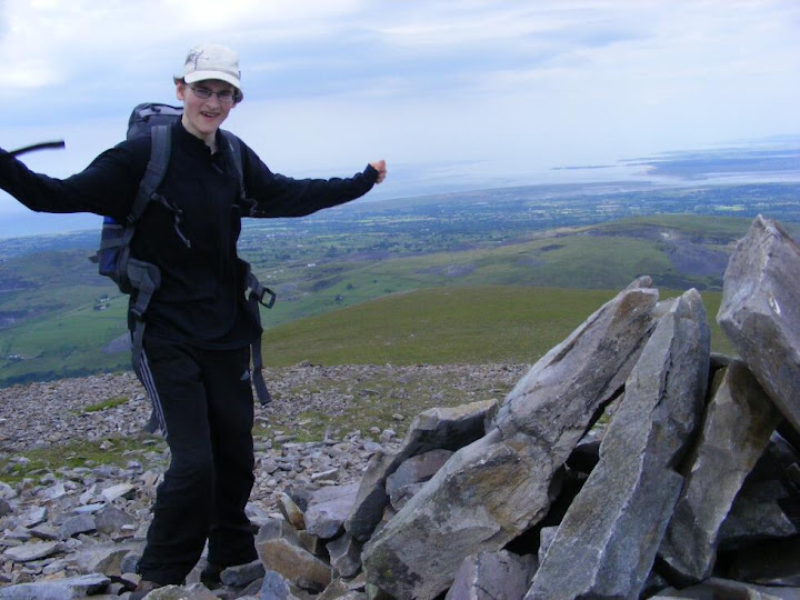 Triumphant at top Alastair looking triumphant at the top of the mountain