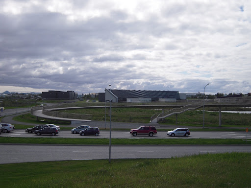 Looking across a highway at a spiral staircase.