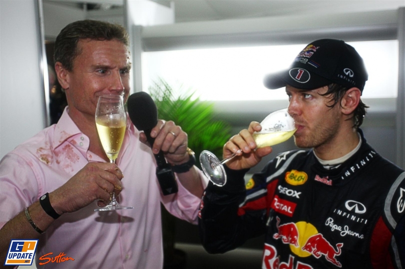 Дэвид Култхард и Себастьян Феттель пьют шампанское на Гран-при Австралии 2011