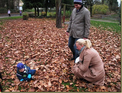 M L playing with leafes