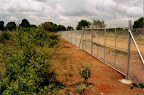 Security fence &amp; main gates on CFA land in Kitgum, completed 2003