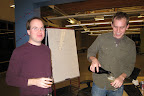 Paul and Bret take a break on launch night just long enough to celebrate with some champagne