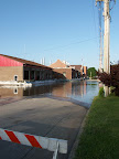 Water surrounding the fire station. The power plant is also just beyond the fire station along the river.