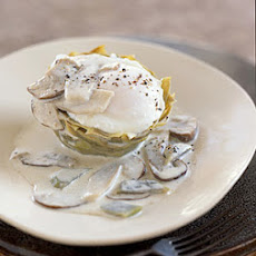 Poached Eggs on Artichoke Bottoms with White Truffle Cream and Mushrooms