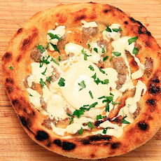 Deep Fried Breakfast Pizza with Sausage, Eggs, Parmesan, and Hollandaise
