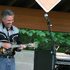 Jeff Rose enjoys a mandolin solo during Reed City Concerts in the Park, Summer 2007.