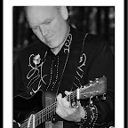 Scott Zylstra concentrates on a guitar break during a band performance at Michigan Legacy Arts Park, Crystal Mt., Summer 2008.