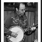 Kevin Gaugier climbs up the neck in a banjo solo at a Detour performance at the Michigan Legacy Arts Park, Crystal Mt., Summer 2008.