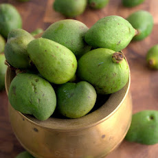 Pickled Baby mangoes in a chile mustard sauce (vadu Mangai)