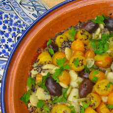 Herbed yellow cherry tomato, white lima bean and black quinoa medley