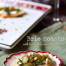 Brie Toasts with Basil Pine Nuts and Golden Raisins