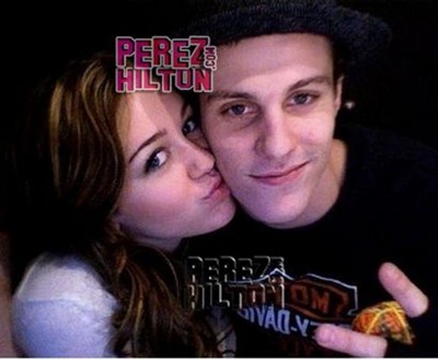 Miley Cyrus kissing Marshall cheek photo 