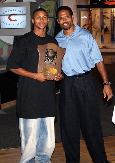 Picture of Todd Doxey received his Star of the Month plaque from Chargers wide receiver Keenan McCardell in 2006