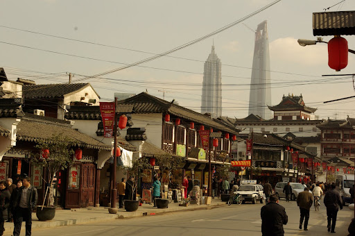 Walking to Yu Yuan garden. Over in Pudong is the tallest building in Shanghai, Jinmao Tower (on the left), and the soon to be tallest Shanghai World Financial Center (on the right).