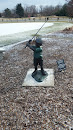 Statue of Child Golfing