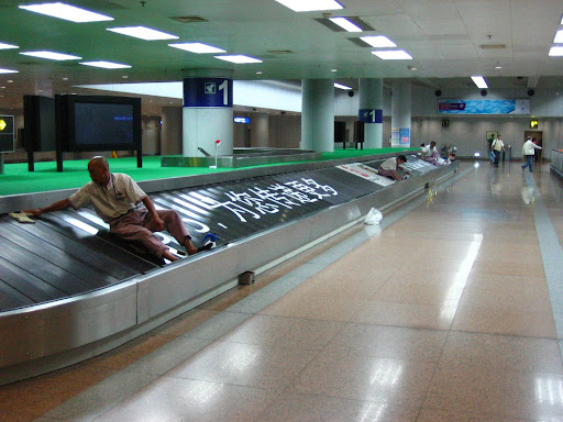 Late in the evening at the baggage claim for international arrivals, Beijing International Airport