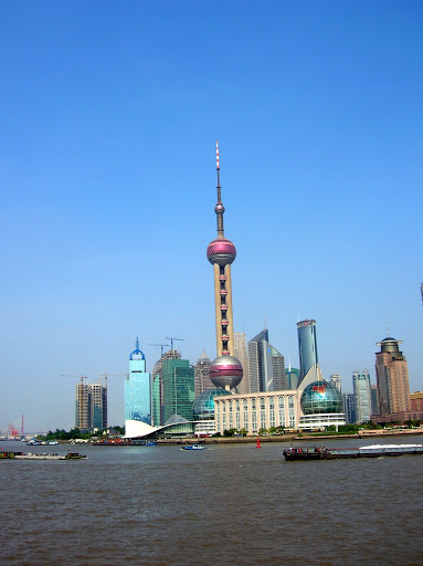 Pudong New Area is a district of Shanghai, China. Since the beginning of its development in 1990 when plans were first announced, Pudong has emerged as China's financial and commercial hub. Pudong is home to the Lujiazui Finance and Trade Zone and a skyline that includes the Oriental Pearl Tower and the Jin Mao Tower, symbolic of Shanghai and China's economic development.