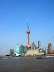 Pudong New Area is a district of Shanghai, China. Since the beginning of its development in 1990 when plans were first announced, Pudong has emerged as China's financial and commercial hub. Pudong is home to the Lujiazui Finance and Trade Zone and a skyline that includes the Oriental Pearl Tower and the Jin Mao Tower, symbolic of Shanghai and China's economic development.