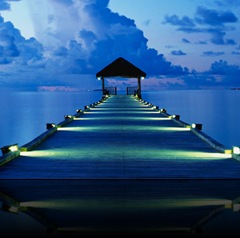 A dock at sunset on White Sands Island in the Maldives.