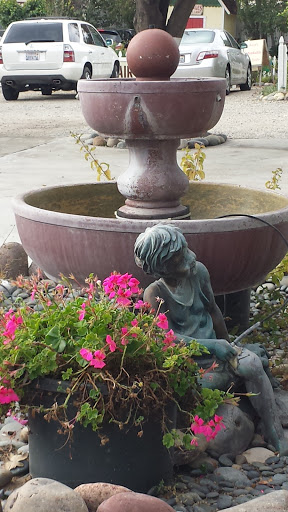 Kid by the Fountain 