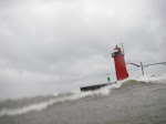 This is a crap picture of the South Haven lighthouse, however you can tell that because the waves are coming up over the concrete the wave here is at least 6' in height. Lake Michigan tends to produce some very nice waves on Northwesterly days. keithwikle.com