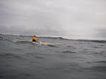 Doug Van Doren catching a ride on a wind wave in his Betsie Bay Valkyrie Sea Kayak, Saugatuck Lake Michigan. keithwikle.com