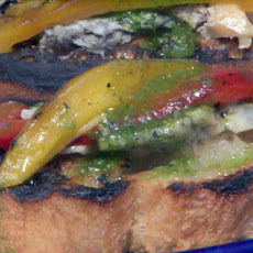 Grilled Bruschetta with Grilled Red and Yellow Peppers, Gorgonzola and Basil Oil