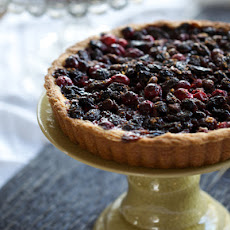 Cranberry Tart with Cognac-soaked Raisins, Tangerine Zest, and Dark Chocolate