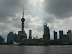 The Pudong-Yu district across the Huang-po river. The tower is the Oriental Pearl, the third tallest freestanding tower in the world, and the large building to the right with the square space in the top is the Shanghai World Financial Center which, when finished, will be the second tallest building in the world.