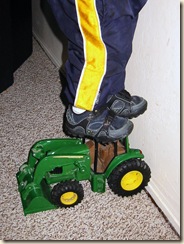 kaylor standing on tractor