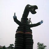 Kai took this picture of me on the tire dinosaur