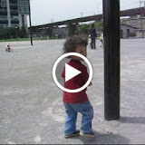 Eidan pretending to crash into posts, at the park adjacent to World City Towers in Shinagawa Eidan pretending to crash into posts, at the park adjacent to World City Towers in Shinagawa