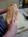 Cut the skin along the backbone.