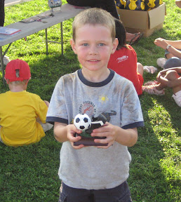 BigE holding his Most Improved Soccer award