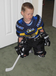 Bige in his hockey gear making a save