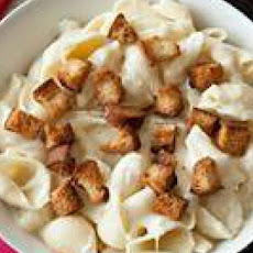 Spooning Mac and Cheese Fondue