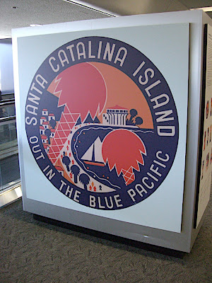 Luggage tag, supersized. All the following graphic images are spaced at intervals throughout the exhibit, but shown here as a grouping.