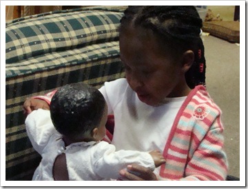 Kiahna playing with her doll