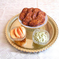 Oatmeal and Carrots Pancakes Served with Avocado Cream and Poached Peaches