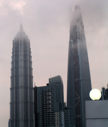 Phil and Steve Get into Shanghai by the Magnetic Levitation Train and a Taxi. Here is the tallest building in the world (460m): the Shanghai World Financial Tower, next to the Jin Mao tower. I departed from the cab to take a photo - I believe that made Phil nervous...http://i2.tinypic.com/s664xy.jpg